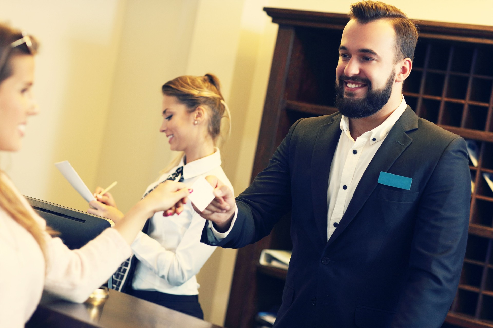 Guests getting key card in hotel