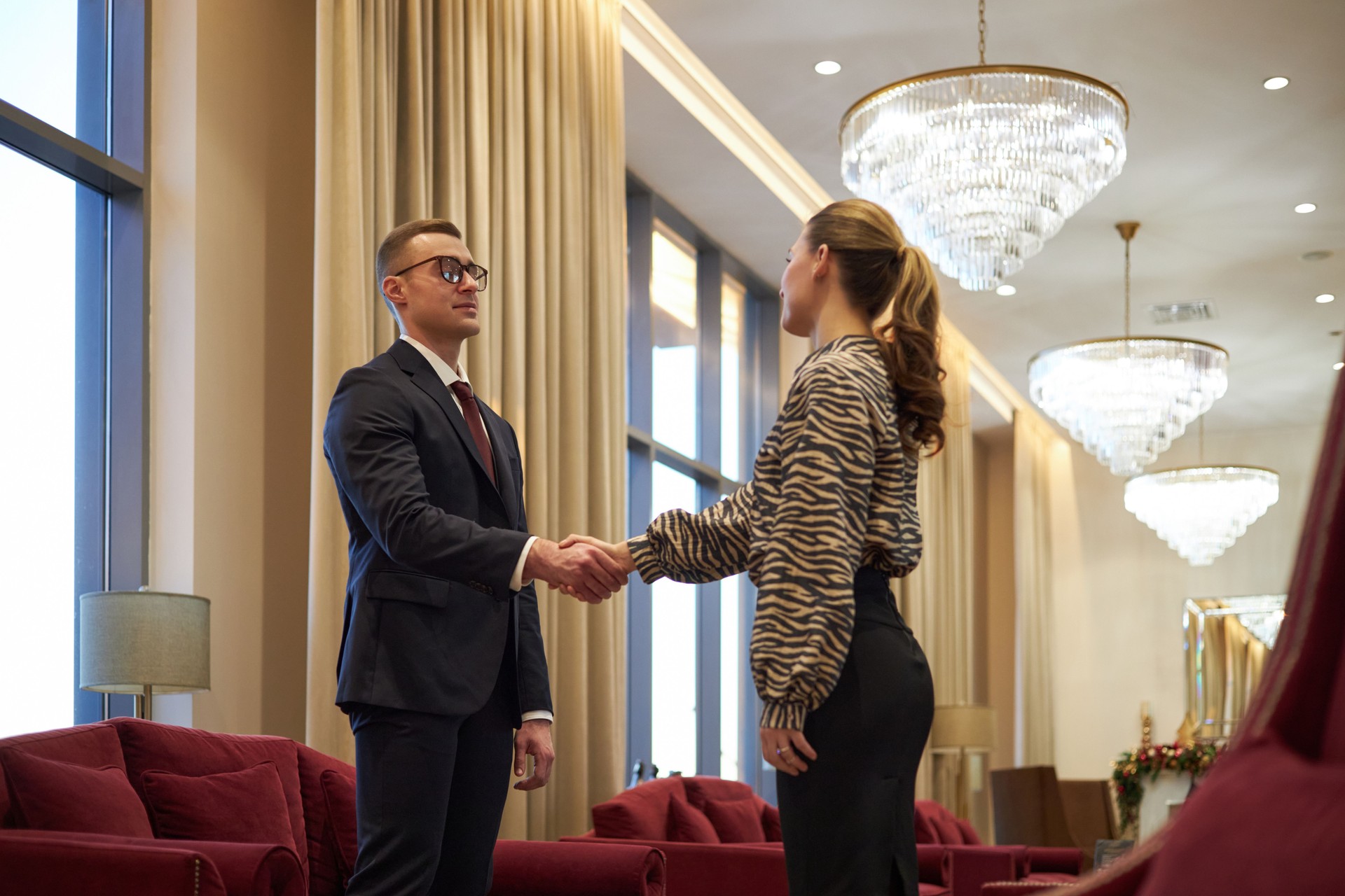 Business Professionals Shaking Hands in Modern Office